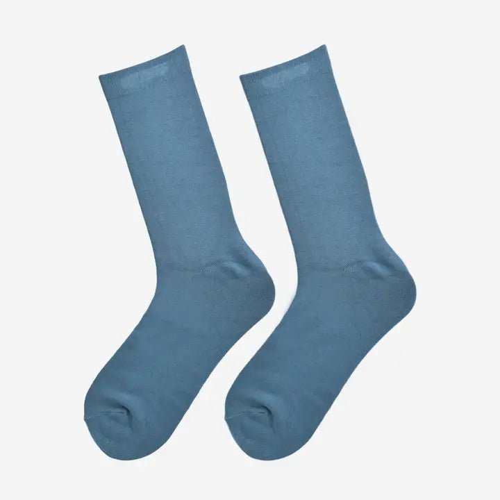 Close-up of soft antibacterial bamboo socks for everyday wear, sustainable men’s fashion accessory in neutral black.