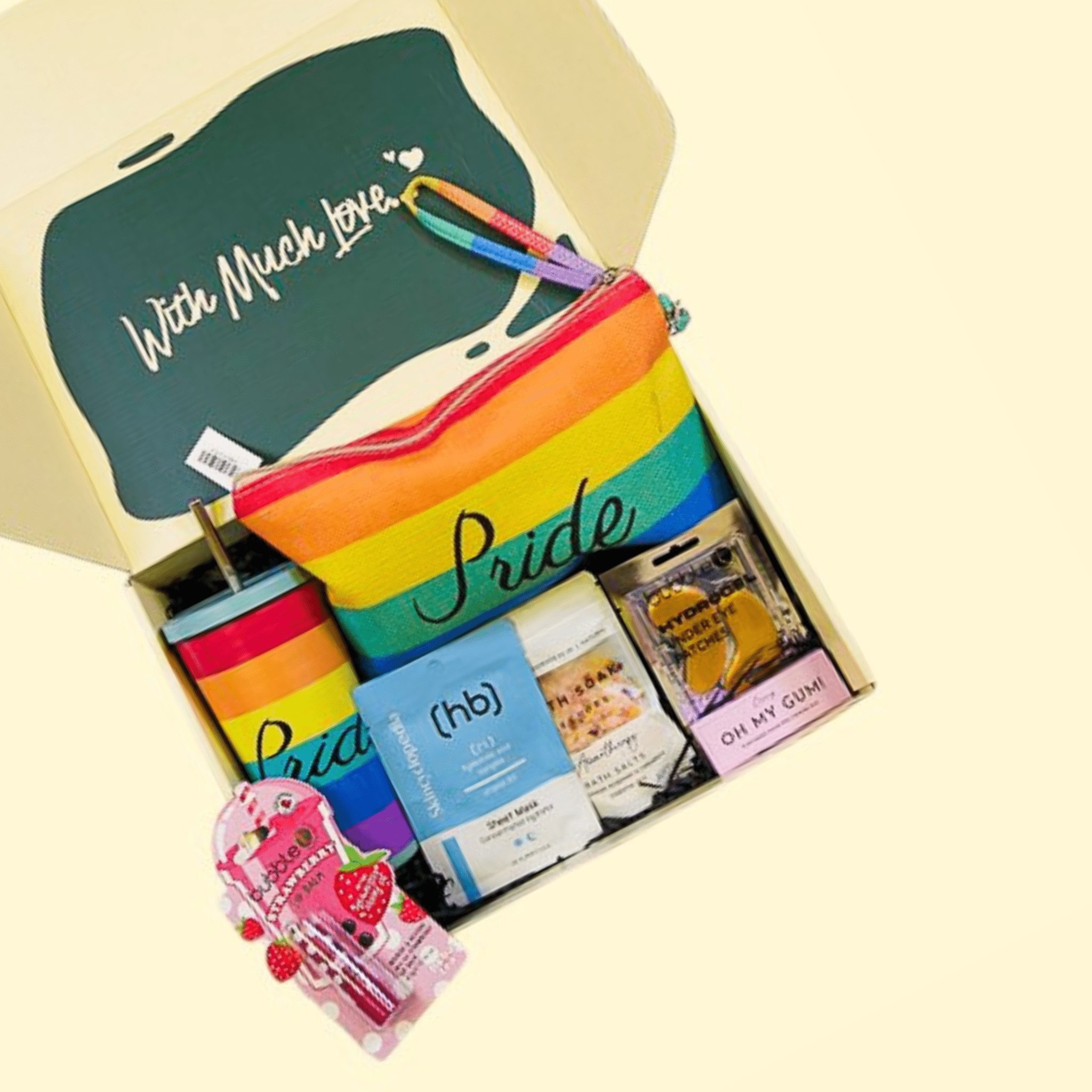 Pride Box self-care gift hamper with purse, bath salts, face mask, and lip gloss
