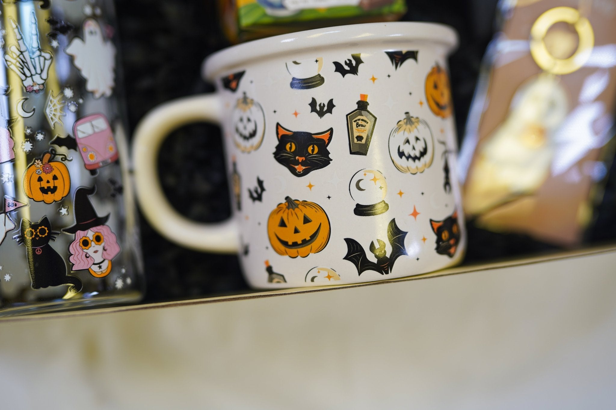 Autumn Halloween treat box filled with cozy socks, mug, and spooky themed goodies