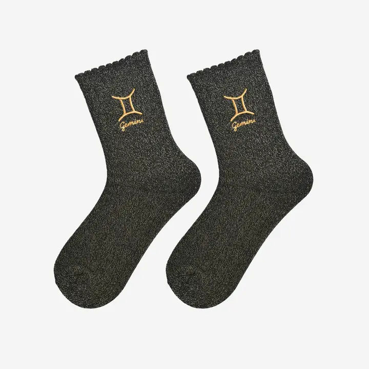 Women’s Gemini zodiac socks in black with gold shimmer and soft scalloped trim.