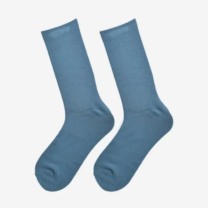Close-up of soft antibacterial bamboo socks for everyday wear, sustainable men’s fashion accessory in neutral black.