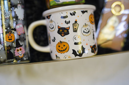 Autumn Halloween treat box filled with cozy socks, mug, and spooky themed goodies